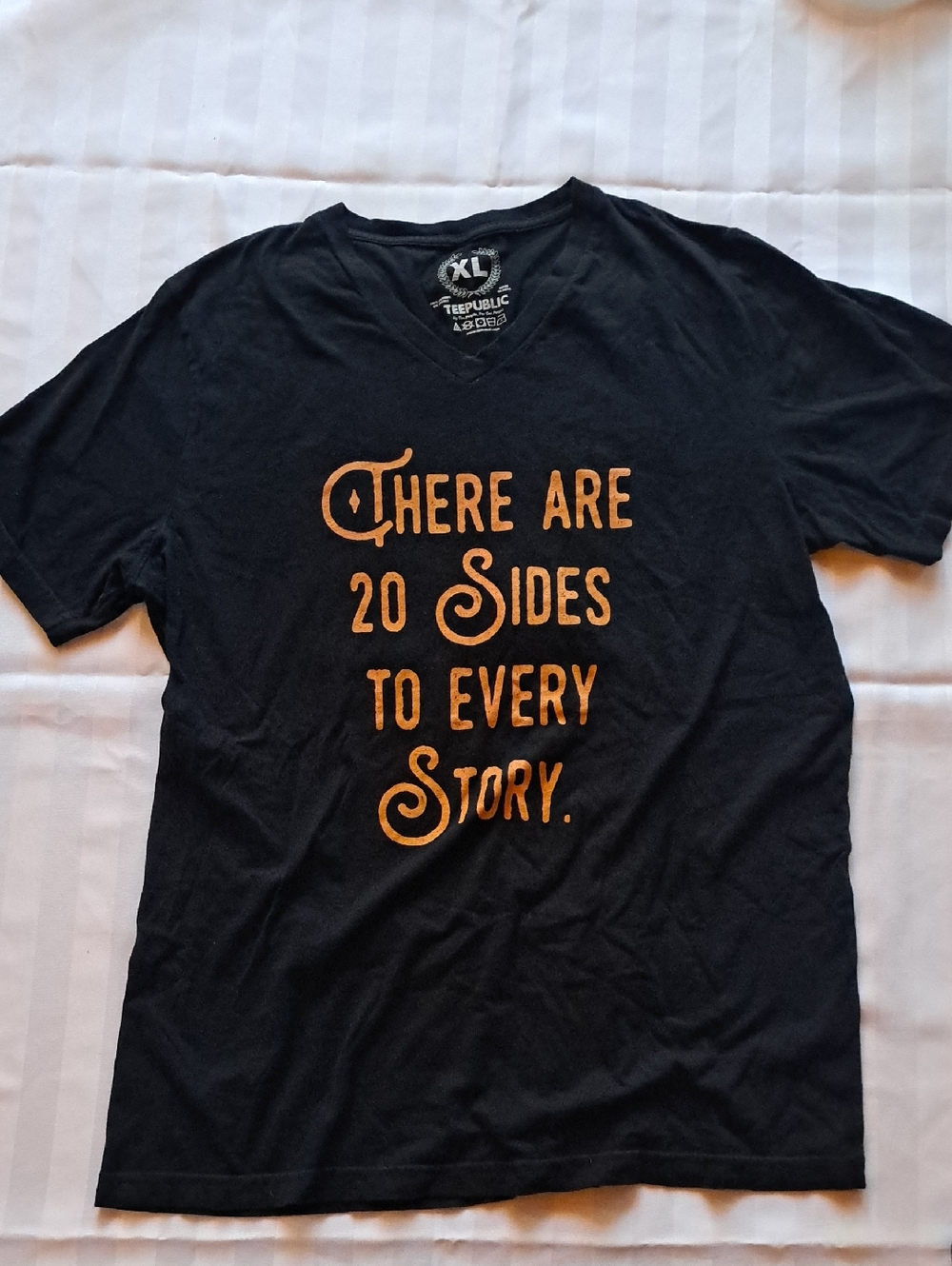 Black V‑Neck Graphic Tee with Orange Script